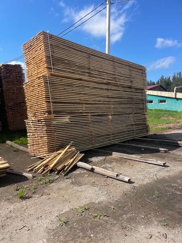 Tall stickered stacks in the storage yard